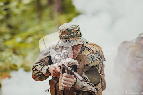 Image of Battle of the military in the war. Military troops in the smoke