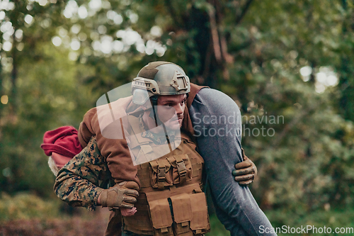 Image of Soldier rescue civilian woman in battle and give medical support help and assistance