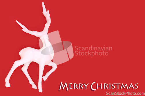 Image of Merry Christmas White Reindeer on Red Background