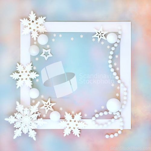 Image of Christmas White Bauble Ornaments on Rainbow Sky Background