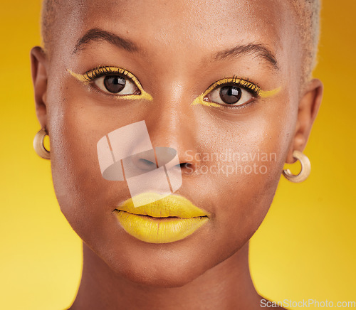 Image of Creative, portrait and cosmetics with african girl with glow in closeup with yellow studio background. Serious, face and makeup with art for beauty or luxury lipstick with design for aesthetic.