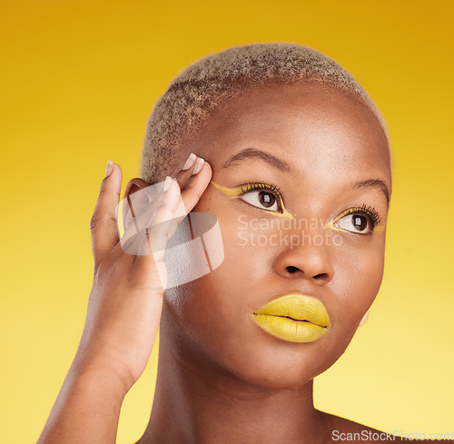 Image of Thinking, creative makeup and black woman with skincare, cosmetics and dermatology on a yellow studio background. Female person, fantasy and model with facial, beauty and aesthetic with self care