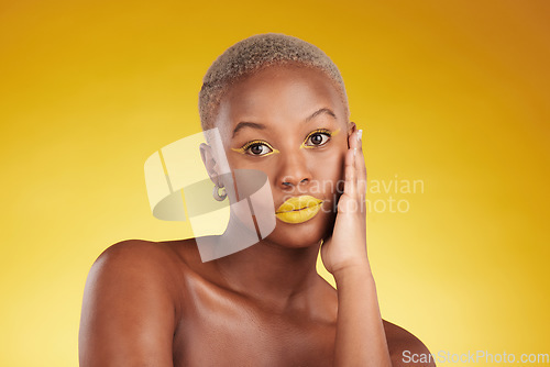Image of Creative, makeup and portrait with african girl for glow in yellow studio, background or luxury spa. Serious, cosmetics and woman with art on face for aesthetic with beauty or wellness with eyeliner.
