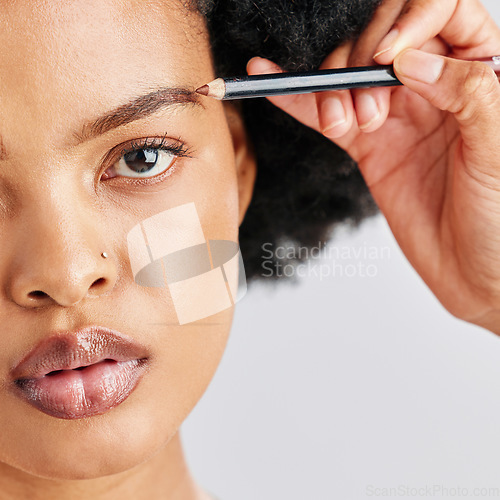 Image of Makeup, pencil and eyebrow of black woman with beauty or eyeliner cosmetic product application for self care and cosmetology. African person and closeup of face isolated in studio white background