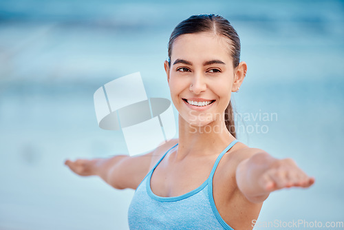 Image of Fitness, yoga and face of woman by beach with warrior pose for wellness, healthy body and energy. Sports, nature and female person stretching arms for exercise, training and balance workout by ocean