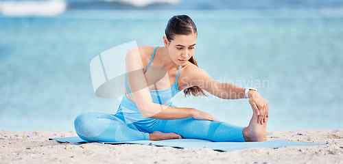 Image of Stretching legs, yoga and woman by beach on sports mat for wellness, healthy body and balance. Performance, nature and female person outdoors for exercise, training and workout by sea for pilates