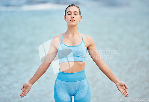 Image of Woman, yoga and relax on beach for meditation, spiritual wellness or outdoor zen exercise. Calm female person or yogi with healthy body for awareness, mindfulness or inner peace in fitness workout