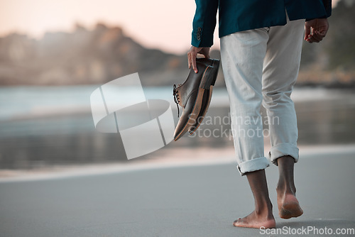 Image of Walking, beach and feet of business man for journey on holiday, vacation and freedom by ocean. Professional, travel and male entrepreneur with shoes for calm, peace and relax in nature at sunset