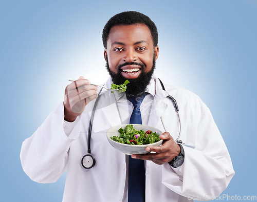 Image of Happy black man, portrait and salad for doctor weight loss, vegan healthcare diet or medical advice for wellness food. Vegetables bowl, nutritionist studio or African person eating on blue background