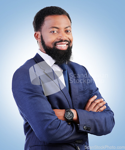 Image of Smile, confidence and portrait of businessman with crossed arms in a studio with success and leadership. Smile, professional and headshot of young, male and African lawyer isolated by blue background