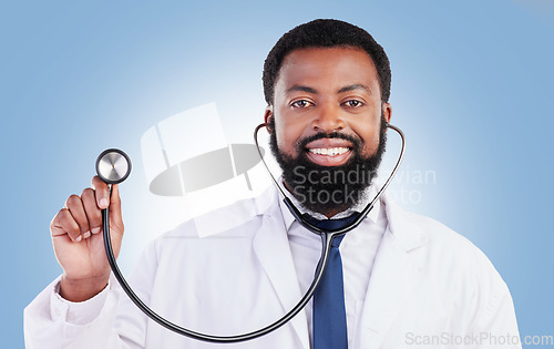 Image of Portrait, stethoscope and man doctor in studio with cardiovascular, exam or consultation on blue background. Heart, health and African male surgeon with medical tool for heartbeat and breathing