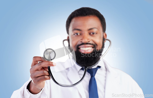 Image of Stethoscope, portrait and man doctor in studio with cardiovascular, exam or promo deal on blue background. Heart, health and African guy surgeon with medical tool for heartbeat, lung and breath check