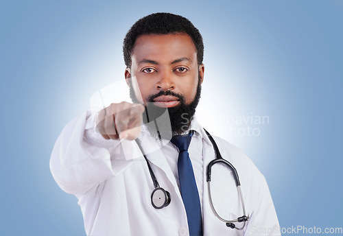 Image of Doctor, hand and black man portrait in studio with offer, deal and promo or announcement on blue background. Face, choice and African male healthcare expert with advice, questions or coming soon news