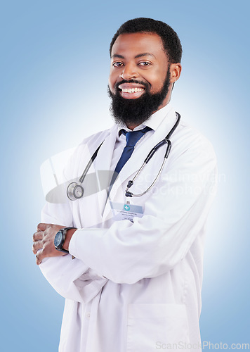 Image of Black man, doctor and portrait with arms crossed in studio or happy medical expert or healthcare worker on blue background. African surgeon, smile and confidence in medicine or research in hospital