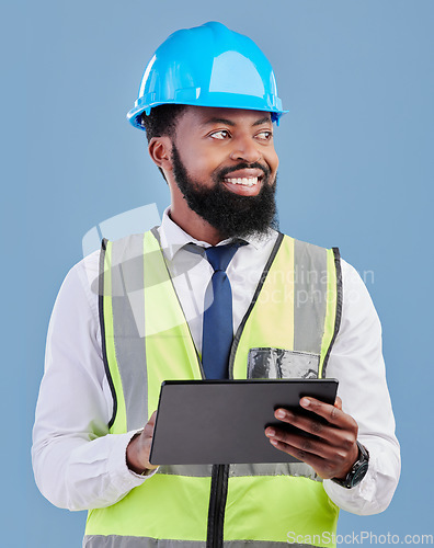 Image of Happy black man, architect and tablet for construction inspection against a blue studio background. African male person, engineer or contractor working on technology for architecture or project plan