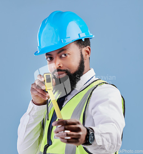 Image of Black man, portrait and architect with measuring tape for construction against a blue studio background. Face of African male person, engineer or contractor in architecture planning with measure tool