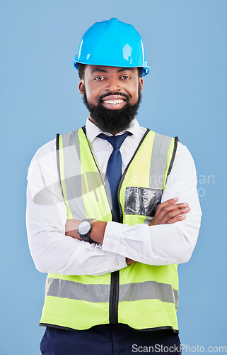 Image of Happy black man, portrait and engineering with arms crossed in studio for safety inspection, maintenance and construction. Architect manager, contractor and industrial technician on blue background