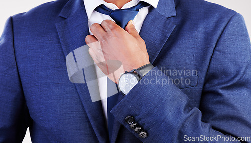 Image of Business, man and fixing tie for fashion, professional clothes and corporate trader in studio. Closeup of male model, executive CEO and salesman in suit for style, pride and ready for job interview