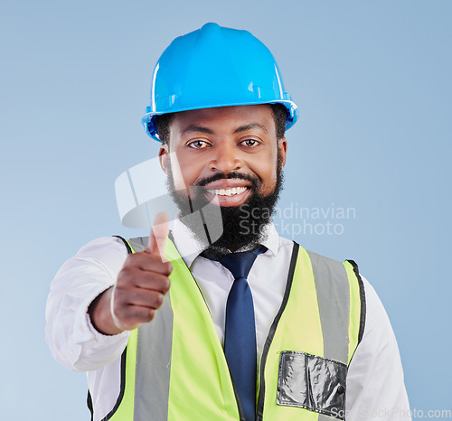 Image of Portrait, engineering and black man with thumbs up for success, thank you or support of architect in studio. Happy project manager, hand emoji and yes for winning construction deal on blue background