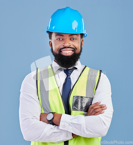 Image of Engineer, happy black man and portrait with arms crossed in studio for building inspection, renovation or industrial management. Male architect, contractor and construction manager on blue background