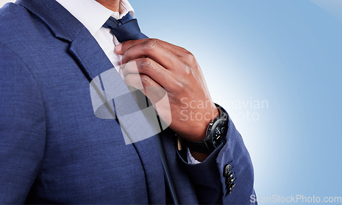 Image of Business man, hands and fix tie for fashion, professional suit or corporate trader in studio with mockup space. Closeup of executive worker, salesman or CEO ready for job interview on blue background