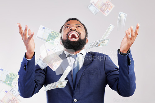 Image of Money, rain and happy black man in studio for savings, growth or cashback bonus on white background, Cash, shower and African winner with investment, success or financial freedom award celebration