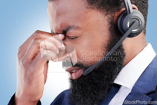 Image of Customer service face, studio black man and sad over consultation mistake, help desk problem or telemarketing burnout. Mental health, call center fail and African person depressed on blue background