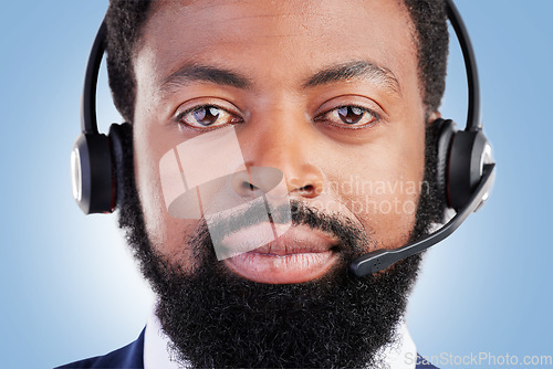 Image of Customer service portrait, studio black man and serious consultant for tech support, help desk administration or telecom. Call center profile picture, face and African person face on blue background