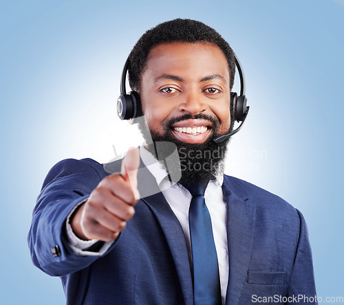 Image of Customer support portrait, happy black man and thumbs up for telecom studio advice, thank you or sales pitch agreement. E commerce vote icon, emoji yes sign and African person face on blue background