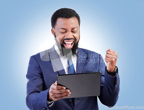 Image of Happy business man, tablet and fist for success in studio for good news, deal and trading bonus. Excited black male trader, digital technology and shout yes for achievement, prize and blue background