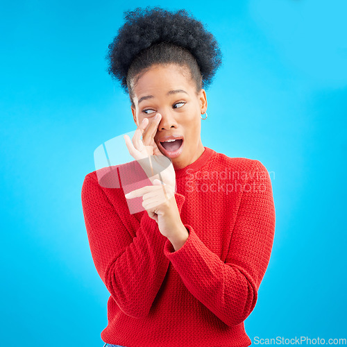 Image of Secret, gossip and black woman in studio pointing isolated on a blue background. Happy, whisper and African person with deal, promotion or news for offer, privacy and announcement of info on mockup