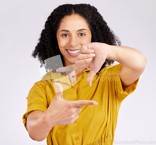 Image of Happy woman, portrait and frame hands for photography, picture or creativity against a white studio background. Female person or photographer smile framing with gesture, shape or icon in photo moment