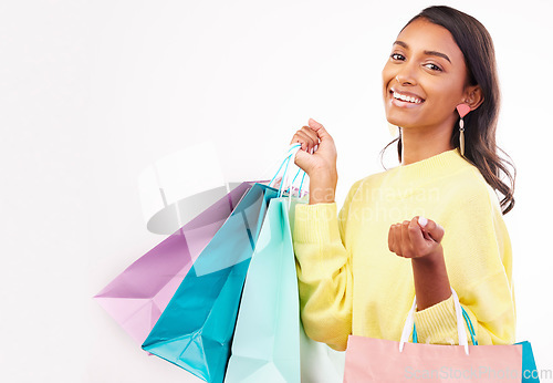 Image of Fashion, shopping bag and space with portrait of woman in studio for product, boutique and deal. Giveaway, promotion and retail with female customer on white background for mall, mockup or store