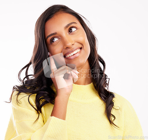 Image of Face, thinking and smile with an indian woman in studio on white background to remember or consider. Idea, decision or nostalgia with a happy young female person daydreaming while looking thoughtful