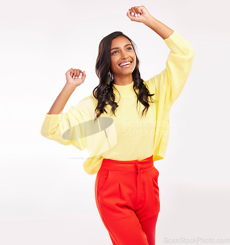 Image of Indian woman, dance and happy with fashion in studio with white background for beauty, cosmetics or happiness on face. Celebration, smile and excited person with fun energy or style of trendy clothes