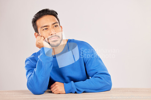 Image of Confused, thinking and space with man and idea in studio for why, brainstorming and question. Doubt, solution and choice with asian person on white background for decision, opportunity and mockup