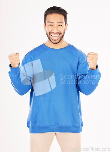 Image of Winner, portrait and man with yes and excited gesture in a studio with a smile. Motivation, happy and male person with achievement and win reaction from target and goal victory with white background