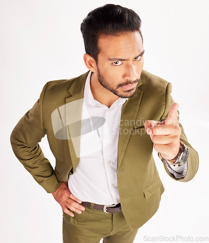 Image of Portrait, blame and scolding with a business man in studio on a white background for discipline. Manager, finger wag and pointing with a serious young boss telling off an employee for control