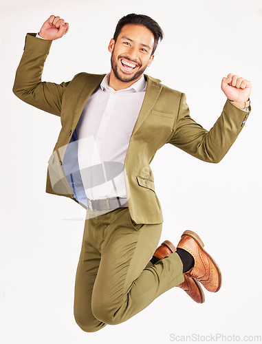 Image of Winner, business man and jump for success, celebration and yes in stock market and bonus on white background. Wow, excited portrait and corporate asian person for financial goals in air and studio