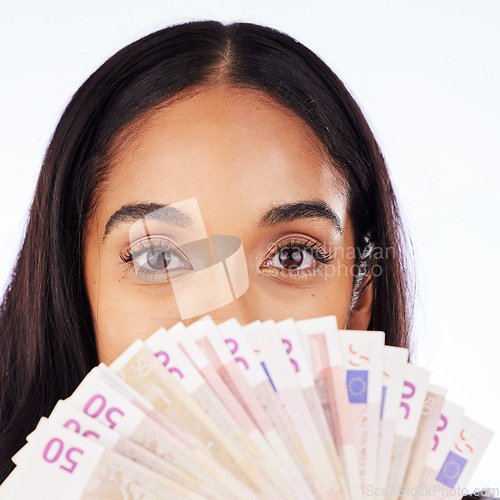 Image of Portrait, cash and a woman lottery winner in studio on a white background in celebration of a bonus or promotion. Eyes, money and finance payment with the face of a young person holding euro notes