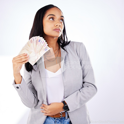 Image of Woman, winner and money in studio from casino, award or cashback payment on white background. Poker, gambling and lady with cash prize from investment, bingo or savings success or financial freedom