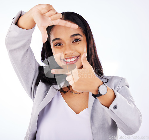 Image of Finger framing, portrait and business woman in studio, white background or creative profile picture. Face of female worker, hands or frame perspective for selfie, photography ideas or planning border