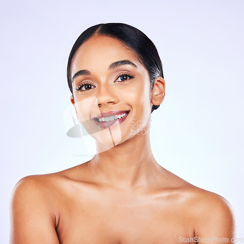 Image of Portrait, beauty and skincare with a model woman in studio on a gray background for natural wellness. Face, smile and aesthetic with a happy young person posing for luxury cosmetics or dermatology