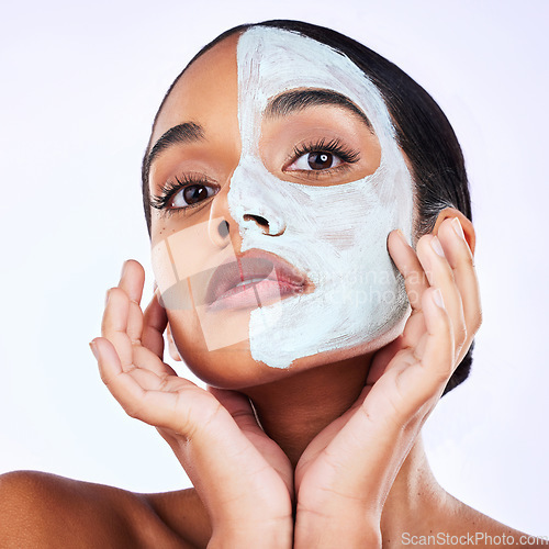 Image of Portrait, face mask and woman in studio skincare, half and cosmetic treatment on grey background. Facial, hands and female wellness model with cream, comparison or result, beauty and satisfaction