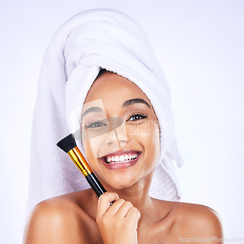 Image of Makeup, portrait and happy woman with brush in studio for application, contour or cosmetic on white background. Face, smile and wellness model for beauty, cosmetology or tool after shower routine
