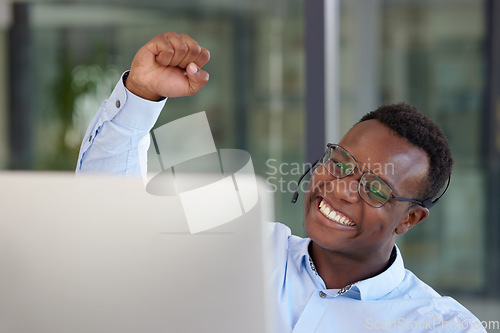 Image of Winner, computer and call center with a black man cheering as a consultant in his customer service office. Success, sale and motivation with a happy young male support agent in a crm workplace