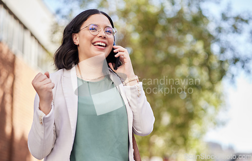 Image of Phone call, celebration and businesswoman with good news in the city walking in the street. Success, happy and professional female person on mobile conversation for job promotion in an urban town.