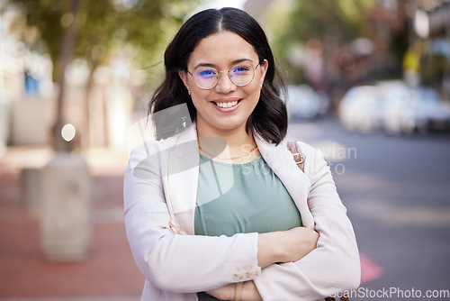 Image of Happy, arms crossed and portrait of woman in city for corporate confidence, work and career. Smile, expert and a professional young female employee in the street or road for travel to the workplace