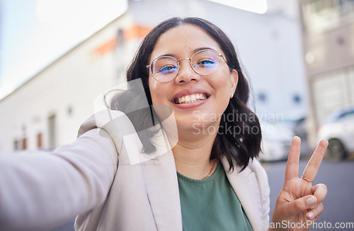 Image of Business woman, selfie and street with peace sign, smile or glasses for blog, finance career or city. Employee, portrait and happy with icon, memory or photography for profile picture on social media