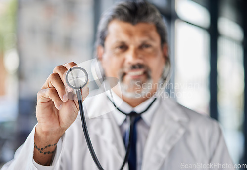 Image of Man, portrait and doctor with stethoscope for cardiology exam, healthcare service and support or check. Heart, listening and medical professional or senior person with clinic or hospital consultation